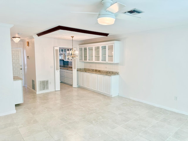 interior space with ornamental molding, light tile patterned floors, and ceiling fan with notable chandelier