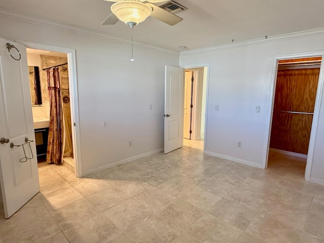 unfurnished bedroom featuring connected bathroom, ornamental molding, and ceiling fan