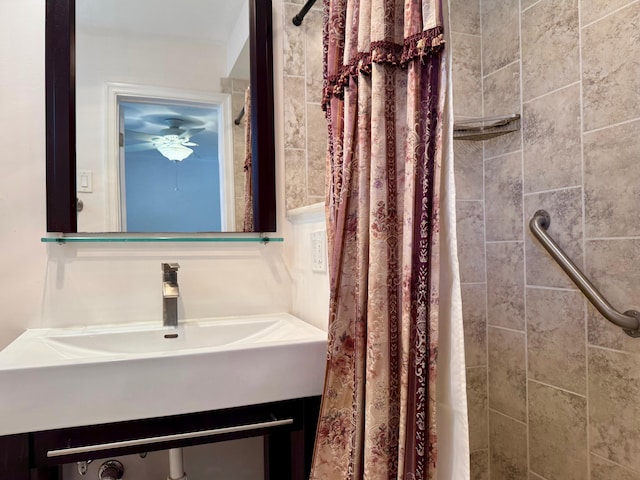 bathroom with vanity and curtained shower