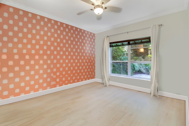 spare room featuring crown molding, light hardwood / wood-style flooring, and ceiling fan