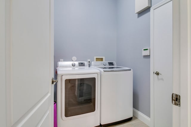 laundry area featuring separate washer and dryer