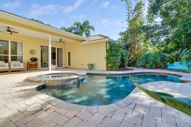 view of swimming pool featuring an in ground hot tub, a patio, and ceiling fan