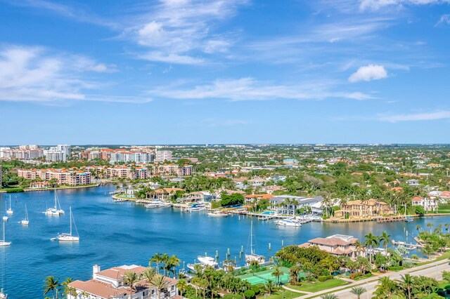 drone / aerial view featuring a view of city and a water view