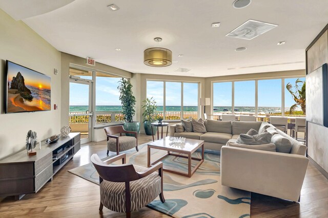 living room with plenty of natural light and wood finished floors