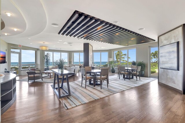 dining space with wood finished floors and recessed lighting