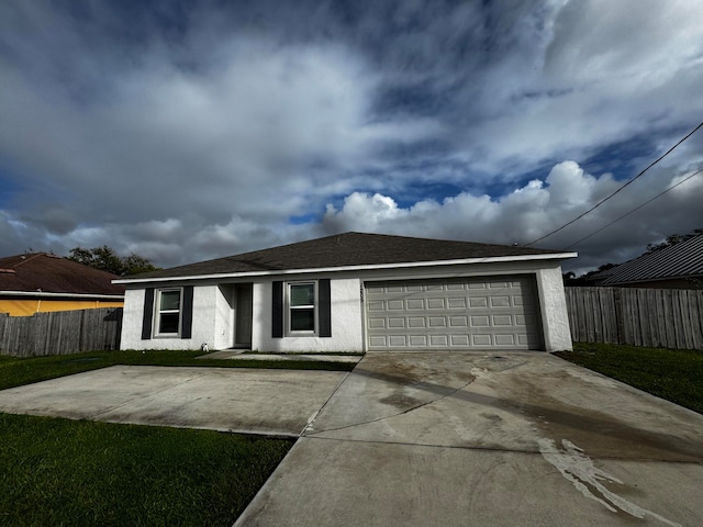 ranch-style house with a front yard and a garage