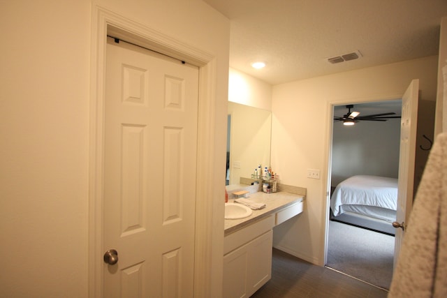 bathroom featuring vanity and ceiling fan