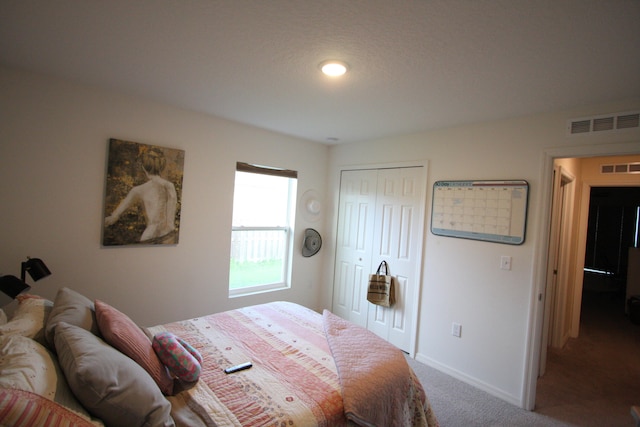 carpeted bedroom with a closet