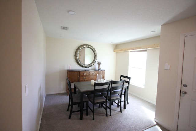 dining space with carpet floors