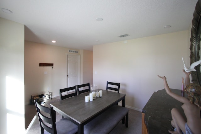 view of carpeted dining area