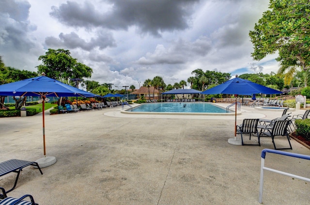 community pool featuring a patio area