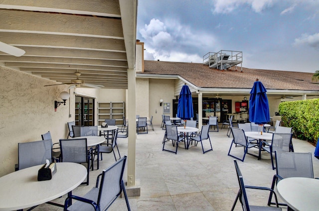 view of patio / terrace with outdoor dining area and a ceiling fan