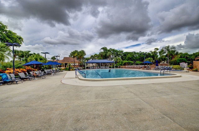 pool with a patio area