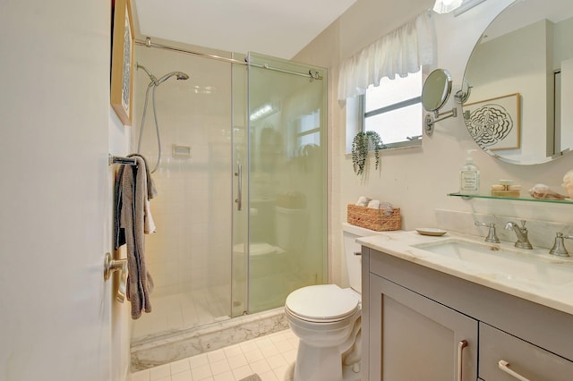 bathroom featuring walk in shower, tile patterned flooring, vanity, and toilet