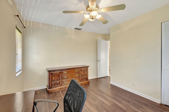 interior space featuring a textured ceiling, hardwood / wood-style floors, and a healthy amount of sunlight