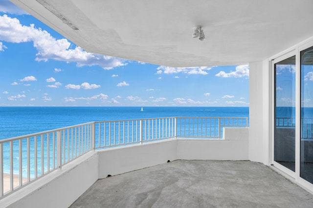 balcony featuring a water view