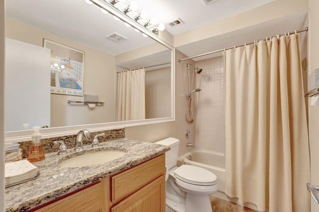 212 Club Dr, Palm Beach Gardens, FL 33418 - bathroom featuring vanity, toilet, shower / tub combo with curtain, and wood finished floors