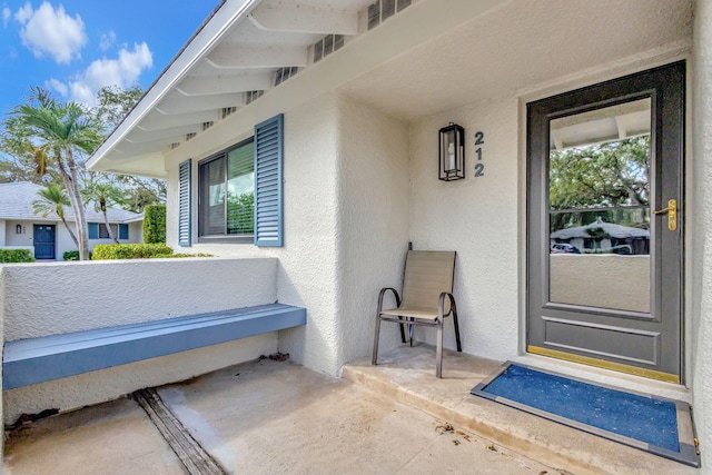 212 Club Dr, Palm Beach Gardens, FL 33418 - property entrance with stucco siding