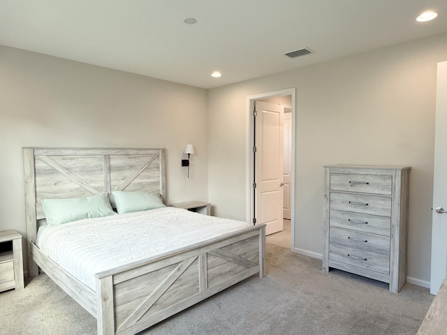 bedroom featuring light carpet