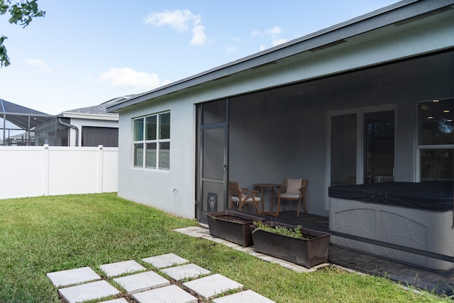 view of yard featuring glass enclosure