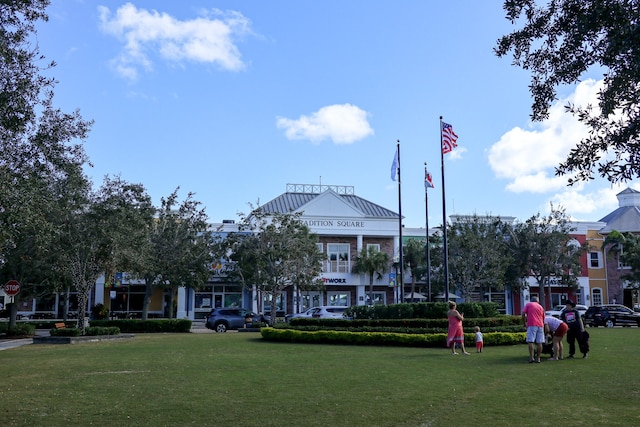 view of home's community with a lawn