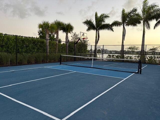 view of sport court with basketball hoop