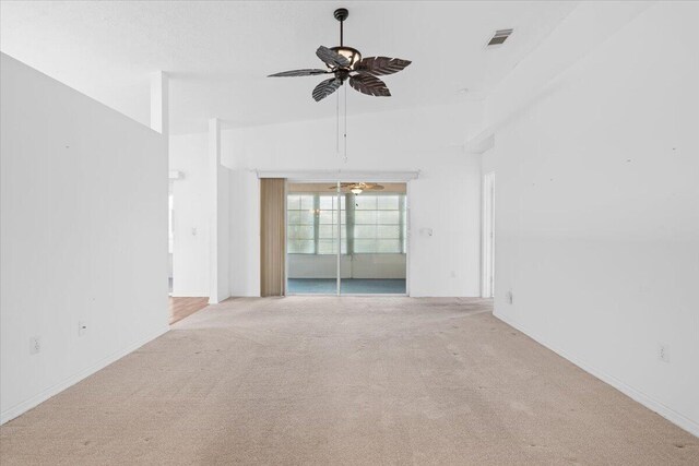 unfurnished living room with lofted ceiling, a textured ceiling, light colored carpet, and ceiling fan