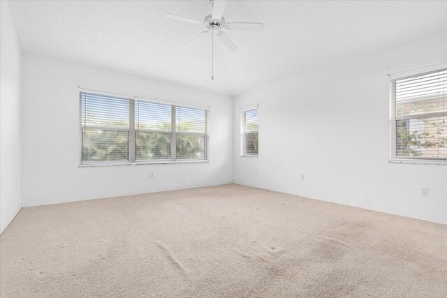 unfurnished bedroom with light carpet and a closet