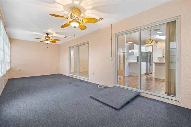 unfurnished bedroom with a closet, light colored carpet, and ceiling fan