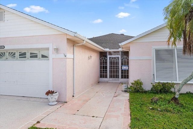 property entrance with a garage