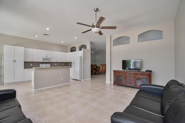 11481 Kanapali Ln, Boynton Beach, FL 33437 - living area with a ceiling fan, light tile patterned floors, a textured ceiling, and recessed lighting