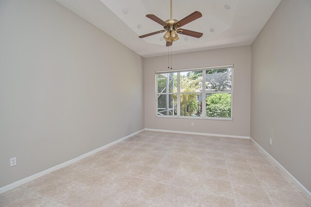 11481 Kanapali Ln, Boynton Beach, FL 33437 - spare room with a ceiling fan, light tile patterned floors, and baseboards