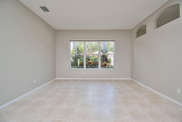 11481 Kanapali Ln, Boynton Beach, FL 33437 - empty room with light tile patterned floors and baseboards