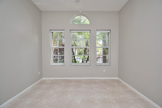 11481 Kanapali Ln, Boynton Beach, FL 33437 - unfurnished room with light tile patterned floors and baseboards