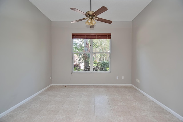 11481 Kanapali Ln, Boynton Beach, FL 33437 - spare room with ceiling fan, baseboards, light tile patterned flooring, and vaulted ceiling