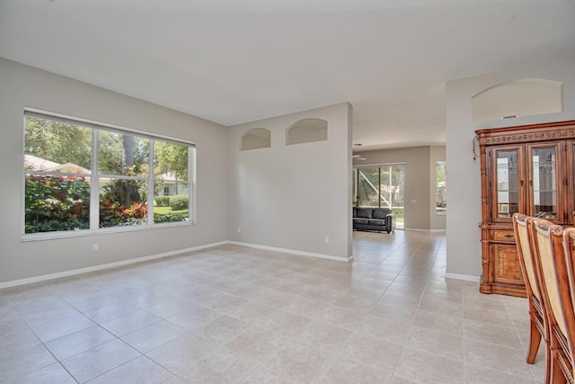 11481 Kanapali Ln, Boynton Beach, FL 33437 - spare room with plenty of natural light, light tile patterned flooring, and baseboards
