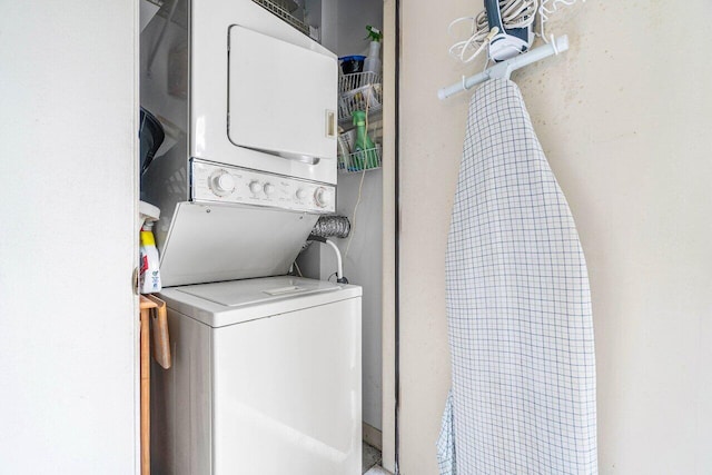 clothes washing area with stacked washer / drying machine