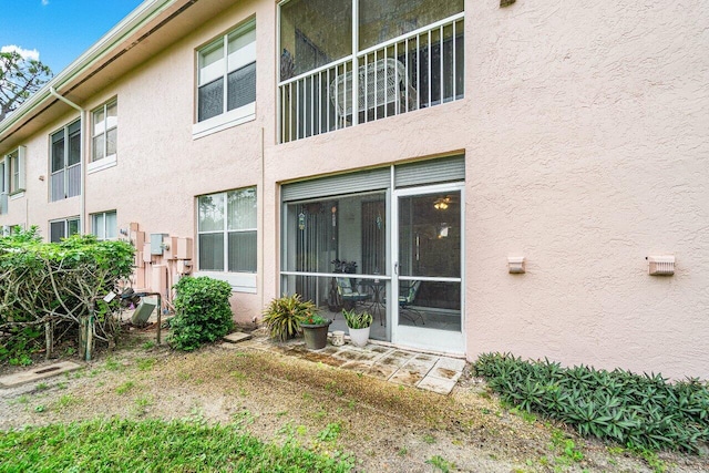 back of property featuring a sunroom