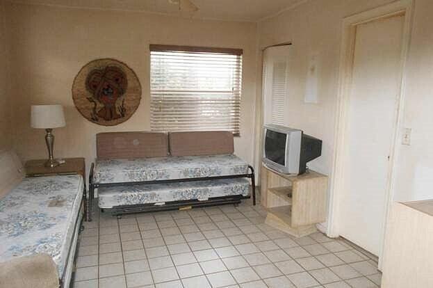 bedroom featuring light tile patterned floors