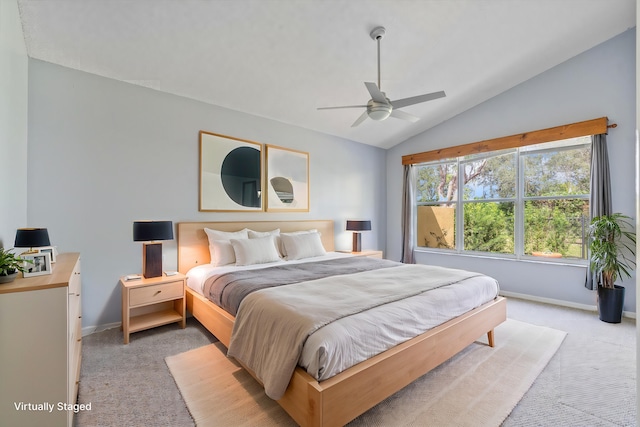 bedroom with vaulted ceiling, light carpet, and ceiling fan