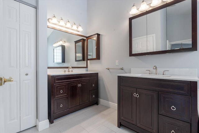 bathroom with tile patterned flooring and vanity