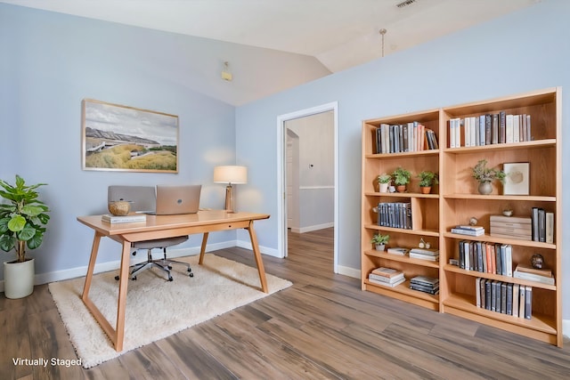 office area with vaulted ceiling and dark hardwood / wood-style floors