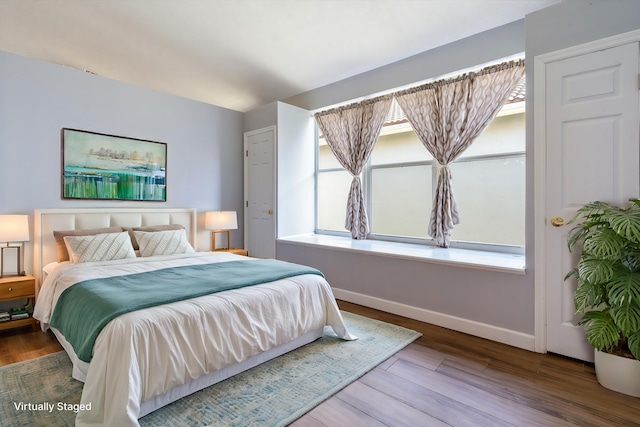 bedroom featuring wood-type flooring