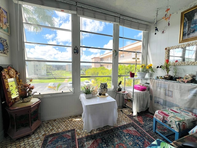 sunroom / solarium featuring a healthy amount of sunlight