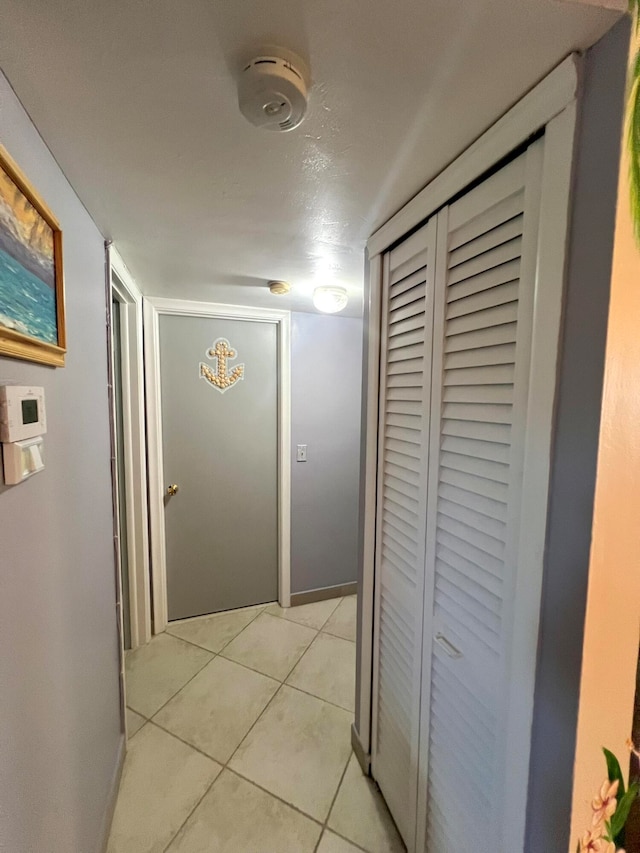 hallway with light tile patterned flooring