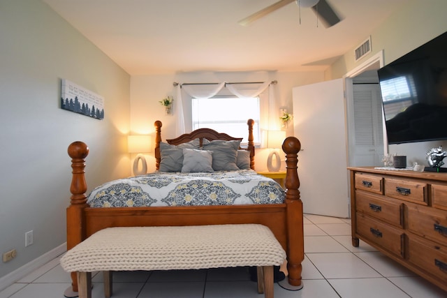 bedroom with ceiling fan and light tile patterned flooring