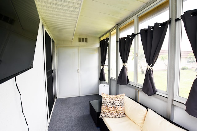 sunroom / solarium with vaulted ceiling