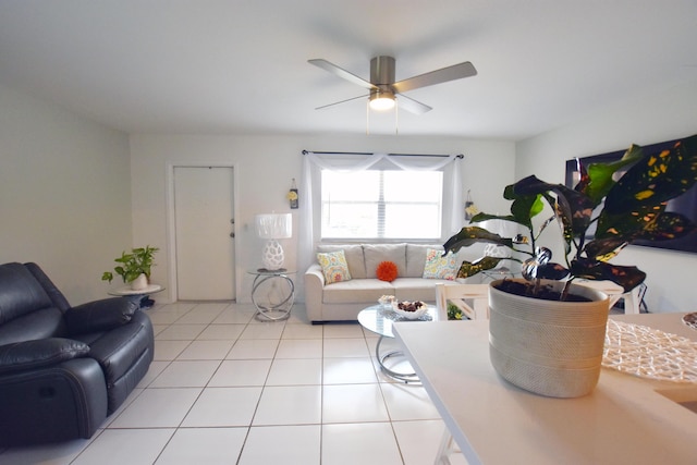 living room featuring ceiling fan and light tile patterned flooring