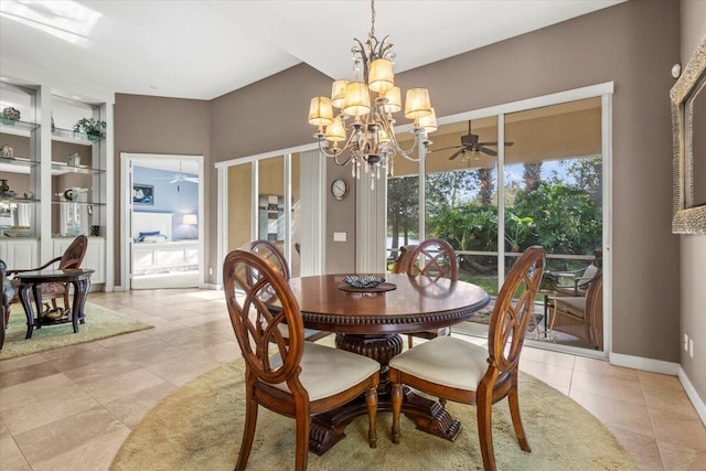 tiled dining area with ceiling fan with notable chandelier