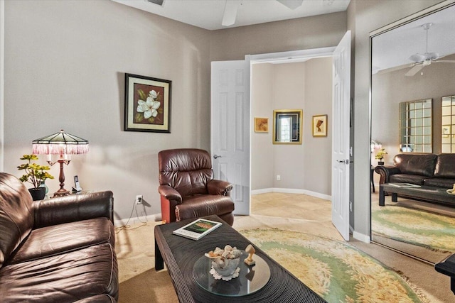 living room with ceiling fan and light carpet